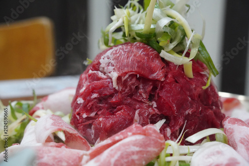 Raw marinated Korean beef Bulgogi piled high with sliced green onions