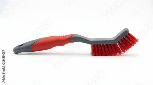 Red and black handled scrubbing brush for cleaning