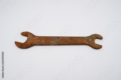 Fotografie rusty double open end wrench, the aged metal surface shows visible corrosion, ox