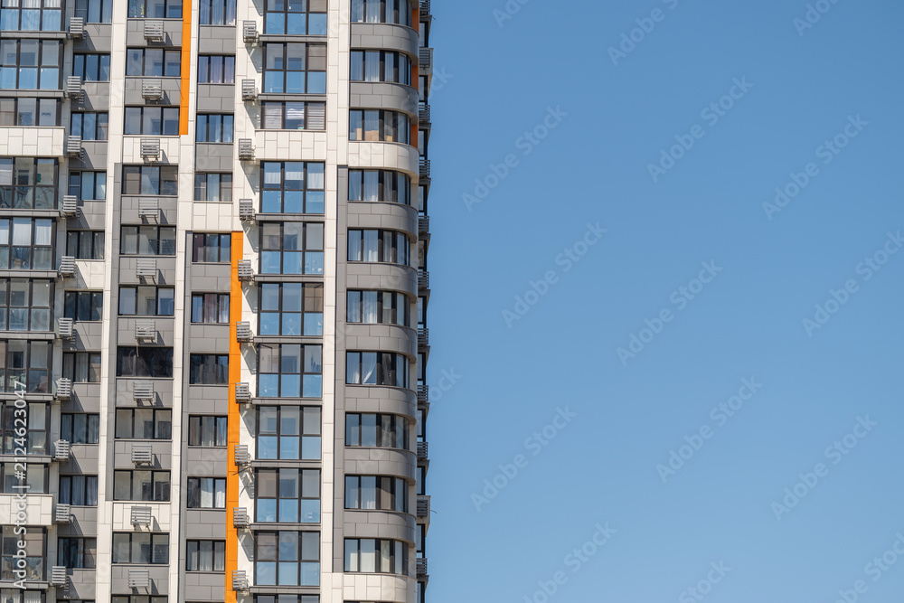 Fototapeta premium Modern architectural beauty shines under clear blue skies in a vibrant urban setting