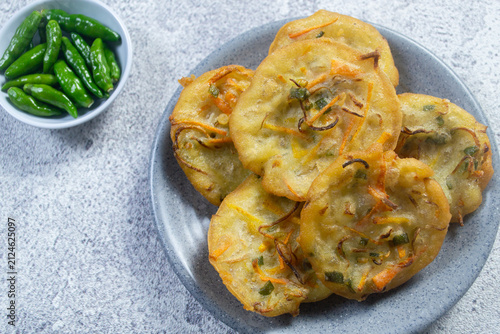 Obraz na plátně homemade Indonesian vegetable fritter or bakwan served on a grey ceramic plate