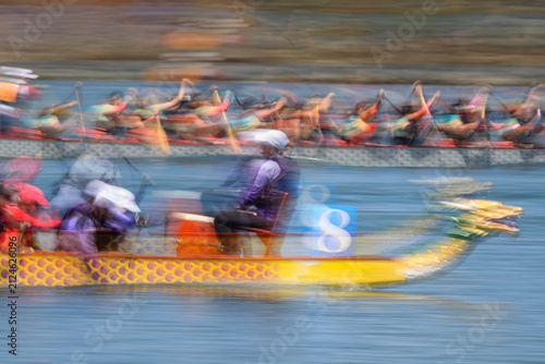 A motion-blurred video captures the speed and intensity of a dragon boat race
