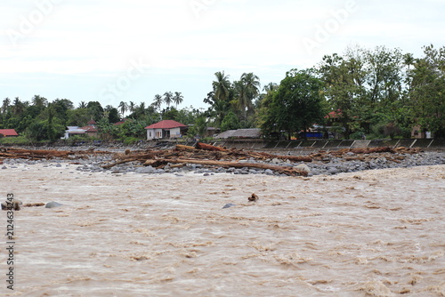 Quadro su tela Severe damage caused by flash floods in Padang City, which swept down large logs from the hills and destroyed everything in their path