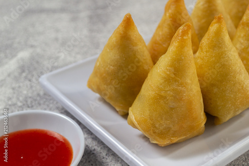 Foto fried tofu spring rolls or Lumpia Tahu, savory snack triangular fried spring rol