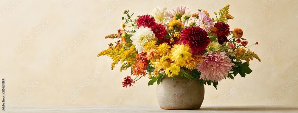 Obraz premium Autumn arrangement featuring elegant flowers against a subtle backdrop. Florist's embellishment. Natural floral setting.