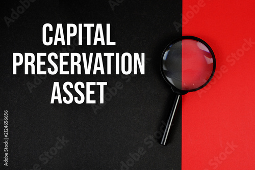 Bild auf Leinwand Capital Preservation Asset text with magnifying glass on black and red backgroun