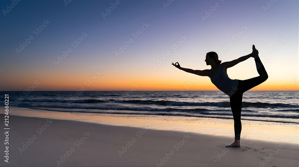 Fototapeta premium Silhouette of woman practicing yoga dancer pose at sunset on the beach