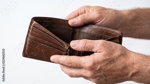 Close up of man hands opening empty leather wallet showing poverty and financial crisis concept