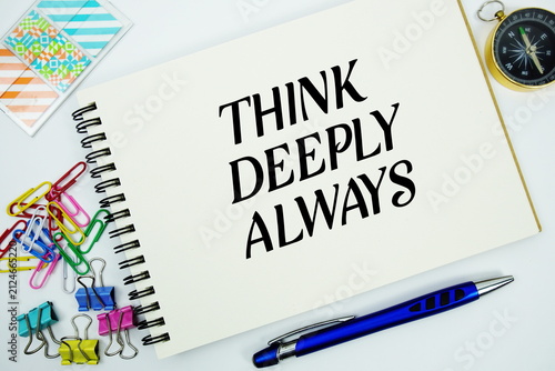 Foto Think Deeply Always text message written on notepad with stationery flat lay on