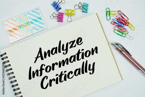 Bild auf Leinwand Analyze Information Critically text message written on notepad with stationery f