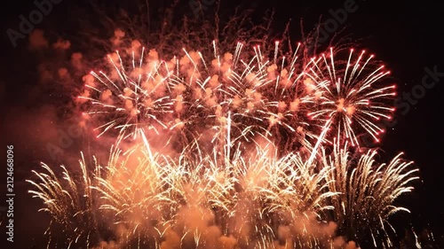 Spectacular Fireworks Display: Red, White, and Blue Explosions in Night Sky
