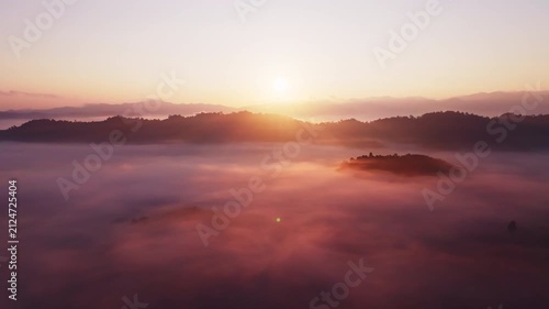 Amazing sunrise with fog move flowing over mountains,Sunrise sky,Aerial view Drone flies over clouds,Rainforest Clouds and fog in sunrise light, Nature and travel background