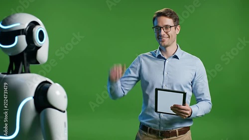 Human-robot Interaction Concept Featuring A Person Engaging And Communicating With A Friendly Robotic Companion On A Green Screen Background
