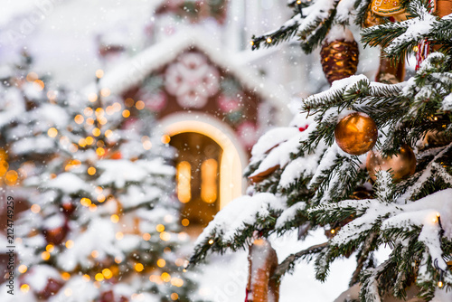 A beautiful Christmas background. The concept of decorations and decor for the New Year 2027. Christmas trees on the streets of Moscow with festive decorations in the snow.
