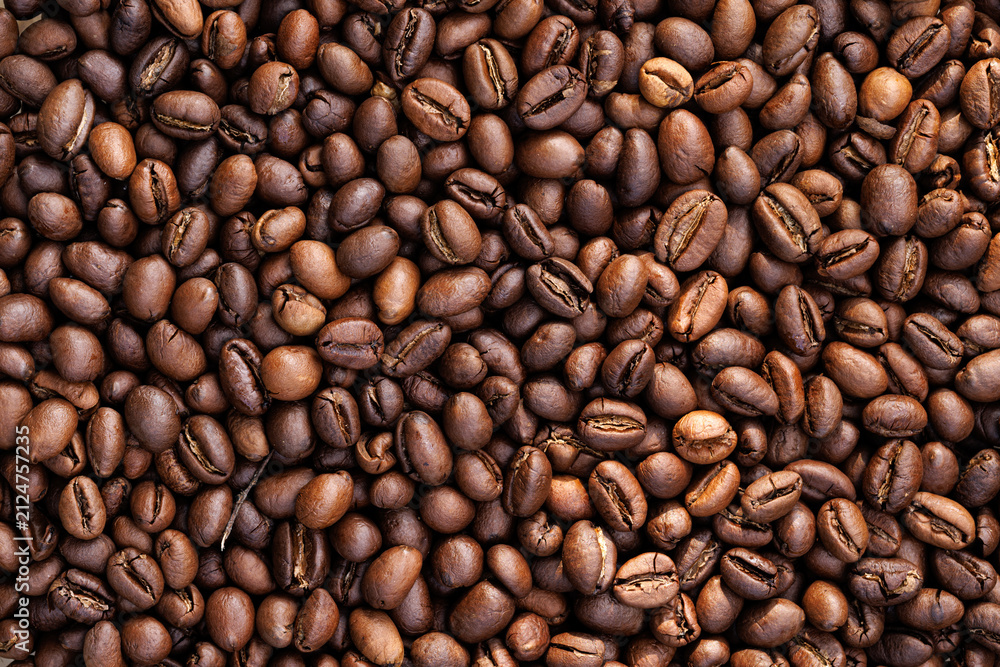 Fototapeta premium Arabica coffee beans from Cuba, macro. Coffee background.