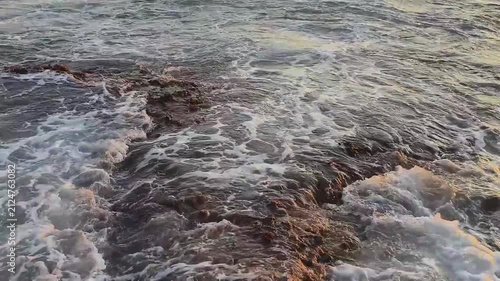 Calm waves at sunset