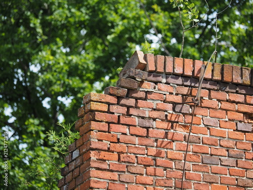 Lightning rod on a red brick wall