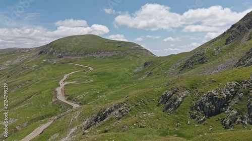 Winding Transalpina Road Through Green Rocky Mountains