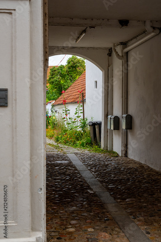 Canvas Print Stone Archway Leading Into a Historic Courtyard, Ribe, Denmark