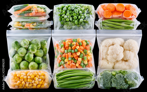 Set with frozen vegetables in plastic bags on white background