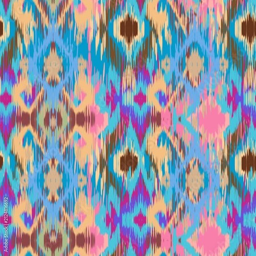 A vibrant modern Ikat bohemian seamless pattern featuring overlapping geometric diamond and zigzag shapes. The design stands out with its distinct fuzzy, brush-stroke edges that mimic traditional hand