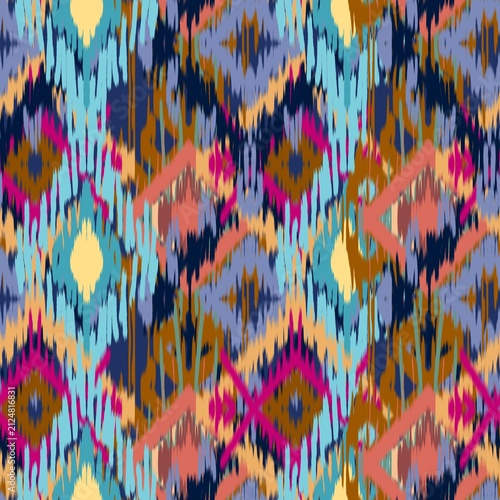 A vibrant modern Ikat bohemian seamless pattern featuring overlapping geometric diamond and zigzag shapes. The design stands out with its distinct fuzzy, brush-stroke edges that mimic traditional hand
