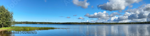 фотографія Panoramic View of Summer Clouds Reflecting on Lake Pyykösjärvi in Oulu