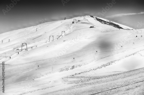Ski resort with chairlifts and skiers, Campocatino, Italy