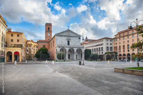 Grand facade of Livorno Cathedral with arches and columns, Italy