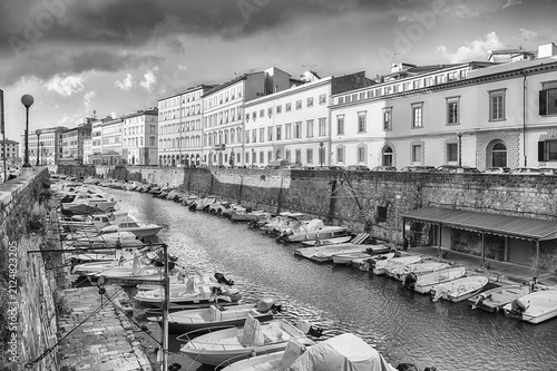 Canals and boats with historic buildings in Livorno, Italy
