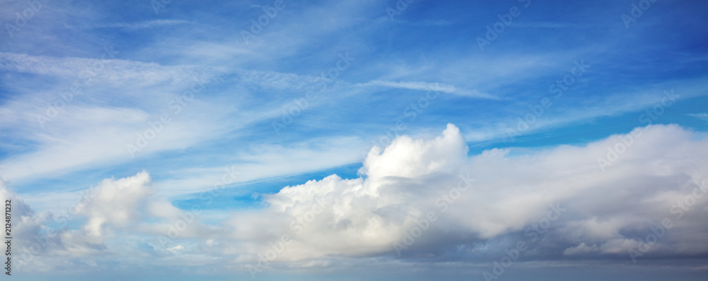 Fototapeta premium Blue sky with clouds. Cloudy sky background. Horizontal banner