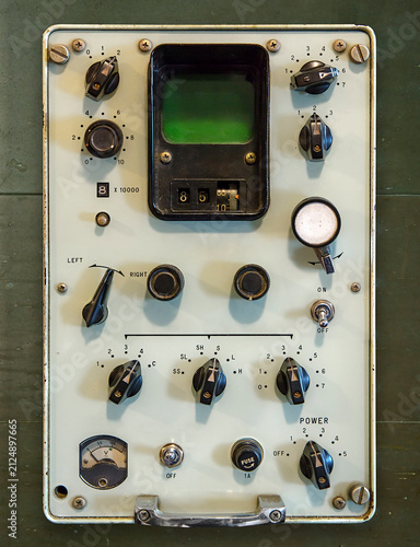 Vintage control panel with knobs and switches