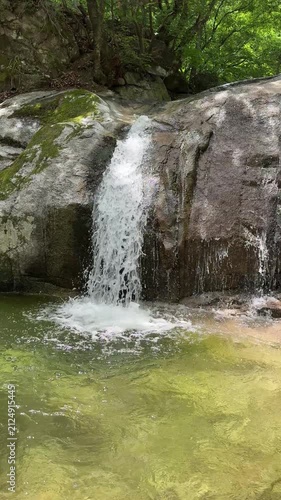 Beautiful and calm small waterfall around Goryeoseonwon Buddhist Garden of Cheongpyeongsa Temple in Chuncheon, Gangwondo, South Korea