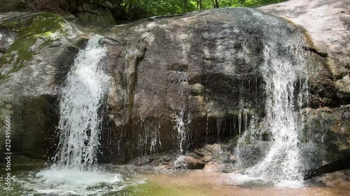 Beautiful and calm small waterfall around Goryeoseonwon Buddhist Garden of Cheongpyeongsa Temple in Chuncheon, Gangwondo, South Korea