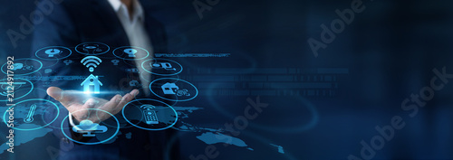 Fotografie Tech technician remotely configuring sensors, holding handheld interfaces for Smart Home integration via Global network servers