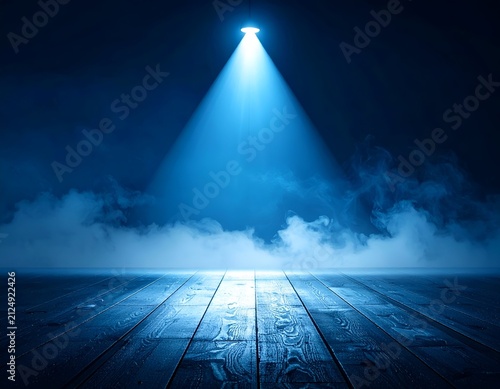 Spotlight illuminates a misty stage with wooden floor, bathed in blue