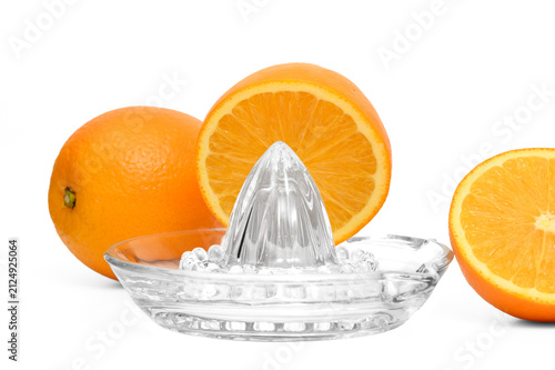 Obraz na płótnie Beautiful ripe juicy oranges arranged on a glass fruit squeezer isolated on a wh