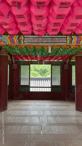 Beautiful historic architecture of the interior of Cheongpyeongsa temple at Goryeoseonwon Buddhist Garden decorated with colorful lanterns in the summer
