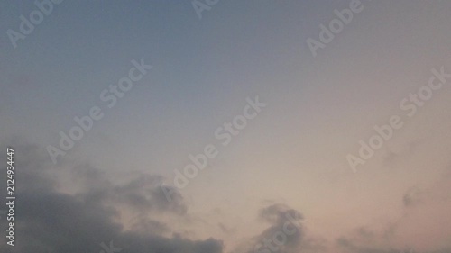 Soft grey clouds moving across a serene twilight sky. Calm and moody natural atmospheric background during early dawn or dusk.