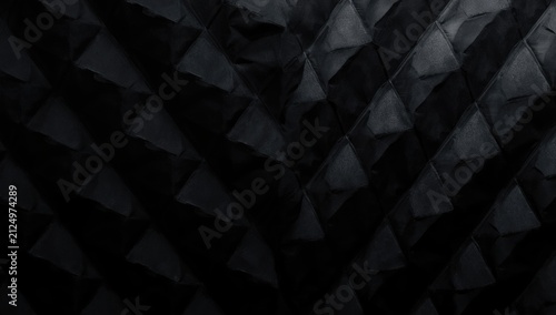 Textured Black Fabric with Geometric Patterns in Low Light