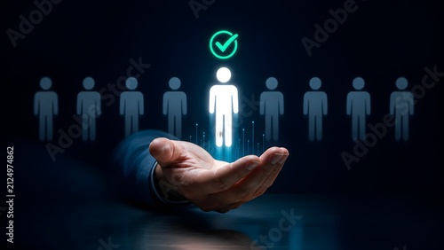 Hand presenting a glowing white candidate figure with a green checkmark standing out from a row of dark figures, symbolizing the selection of the best talent.