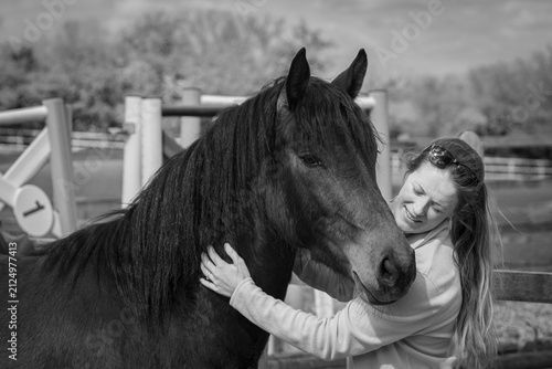 Woman Comforting a Connemara Pony in Black and White