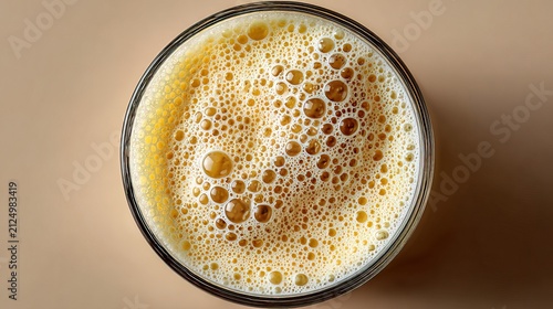 Close-up of Frothy Beer in Glass Cup.