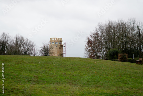 Stone Observation Tower Under Renovation on a Hillside in Lansac, France