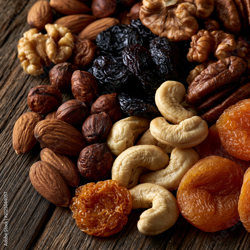 An image of high-quality dried fruits and nuts. For advertising purposes. Rustic-style presentation. Homemade food.