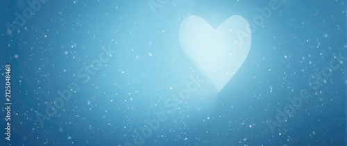 Soft Heart Shape in Falling Snowflakes Against a Blue Background