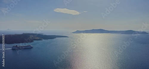 Quadro su tela Panoramic view of volcanic caldera bay with cruise ship sailing near Nea Kameni