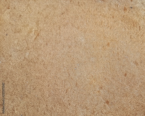 Abstract close-up background texture of brown porous foam sponge material. 