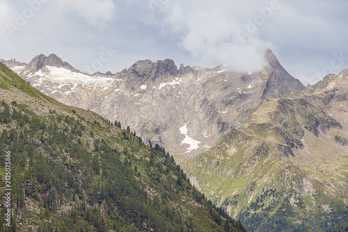 The clouds are parting around the Ahornspitze., seen from the crown of the Zillergrund dam