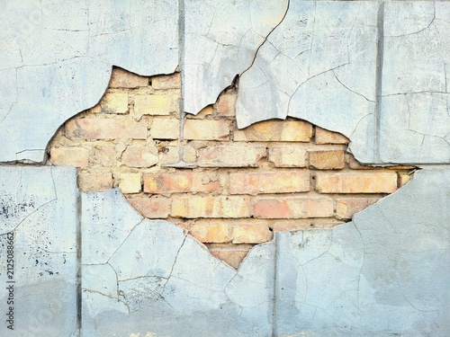 Canvas Print Cracked Plaster Wall Revealing Old Yellow Brick Masonry Texture